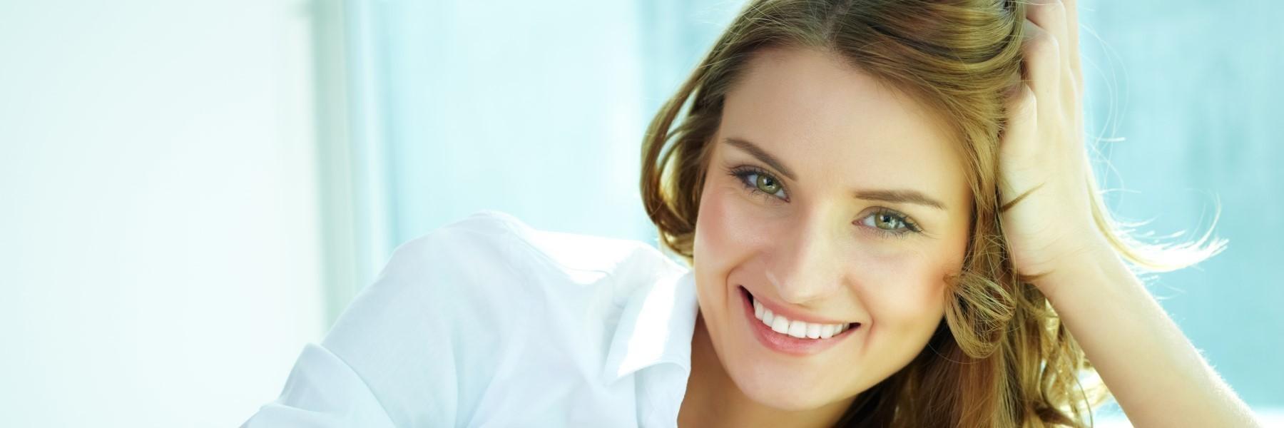 woman after professional teeth whitening exam in flowery branch ga