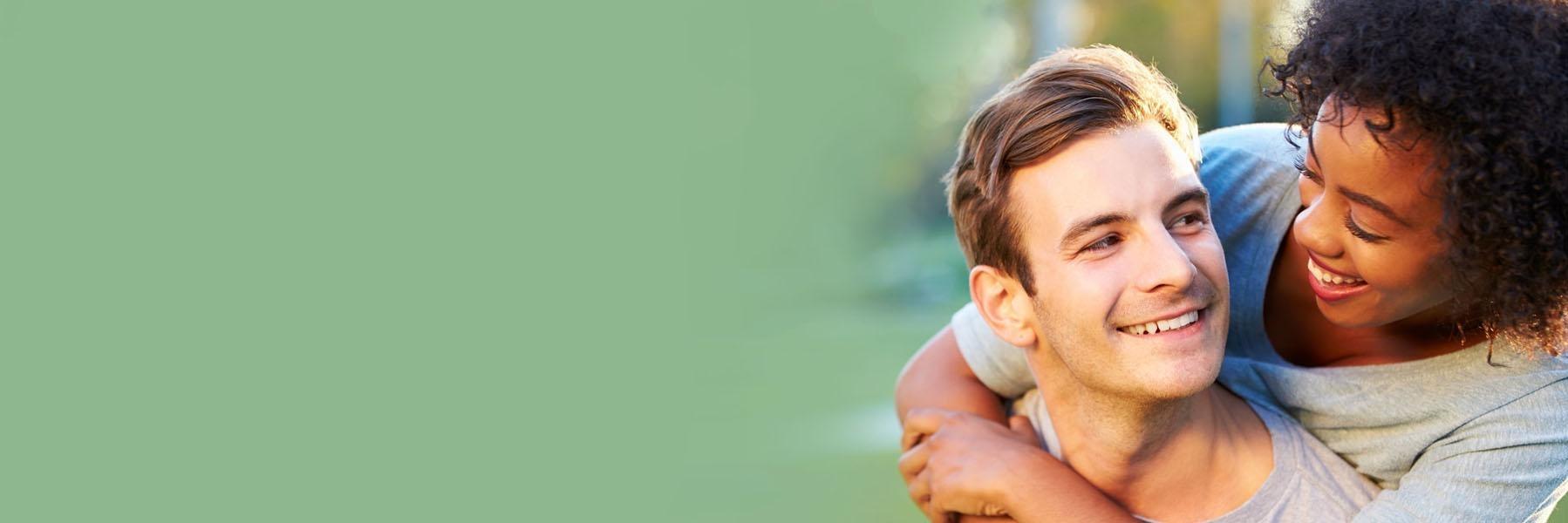 Young couple smiling after Swollen Gums treatment | Flowery Branch GA