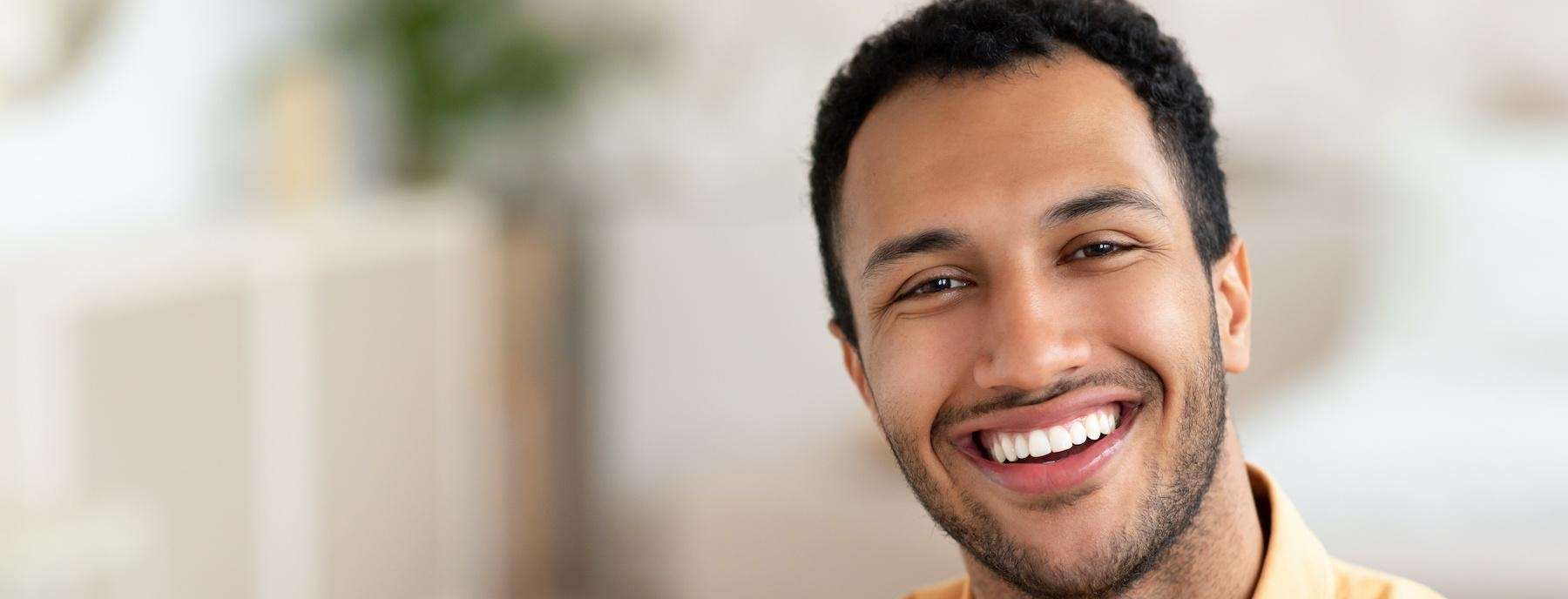 man smiling after getting dentures in flowery branch ga