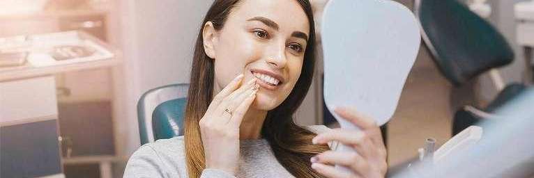 woman smiling after getting dental crowns flowery branch ga