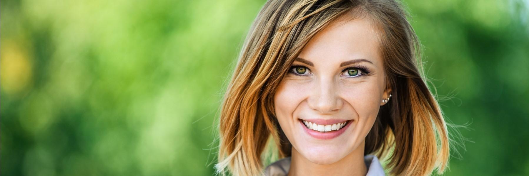 Young woman with bright smile l dental sealants oakwood ga
